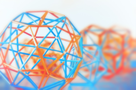 Coloured three-dimensional model of geometric solids closeup defocused - abstract blurred background.