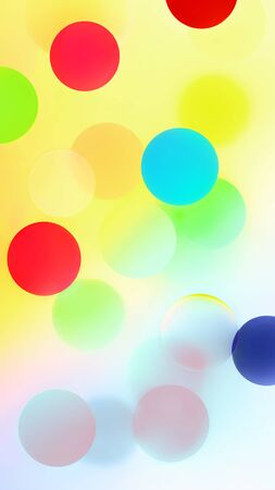 Abstract bright colorful pattern with multicolored bubbles and confetti. Creative festive blurred background for digital wallpaper or print and web design. Space for copy.の写真素材