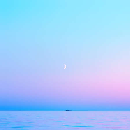 Cloudless pink and blue sky with a crescent moon reflected in the water surface in the White Nights season. Abstract square blurred background of calm seascape with copy space. Lake Onega, Russia.の写真素材