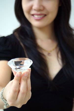 Lady holding a diamondの写真素材