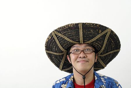 Asian man with mexican hatの写真素材