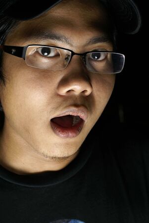 Frightened asian male portraitの写真素材