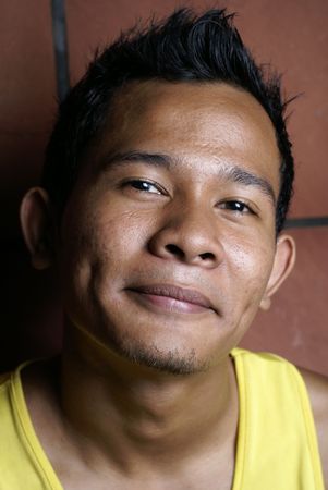 Smiling young asian maleの写真素材