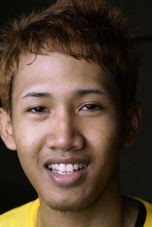 Young smiling asian man portraitの写真素材