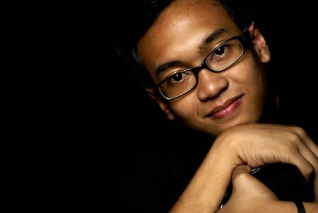 Relaxed young asian man portraitの写真素材