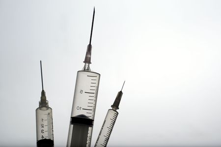 Three medical syringes の写真素材