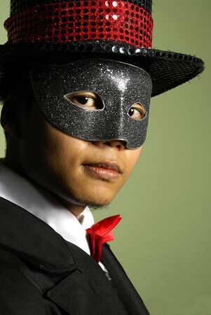Asian man in mask and top hatの写真素材