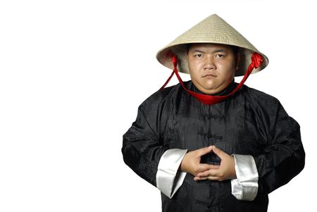 Traditional asian man standing with conical straw hatの写真素材