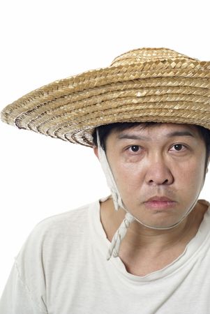 Asian peasant with blank expression and straw hat on whiteの写真素材