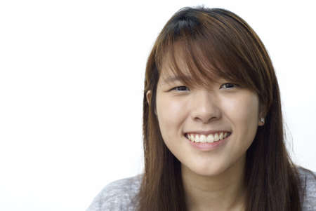 Happy asian teen lady smiling の写真素材