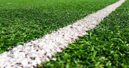 White line on Green grass sport field for sport conceptの写真素材