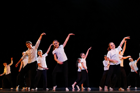 DNEPROPETROVSK,UKRAINE - December 13, 2014 - School-theater of Contemporary dance POTOKI, Dnepropetrovsk Teens class dancers perform a composition "School" at Winter Annual Entertainment "Let the sun in"のeditorial素材