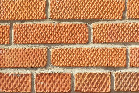 Old brick wall and grey cement seams  background