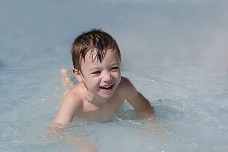 Small boy in swimming pool; summer fun の写真素材