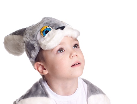 Close-up portrait of small boy in hare costume isolated on white background