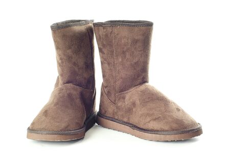 Pair of brown winter boots over pure white background