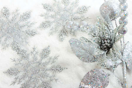 Silver christmas baubles on  white snow backgroundの写真素材