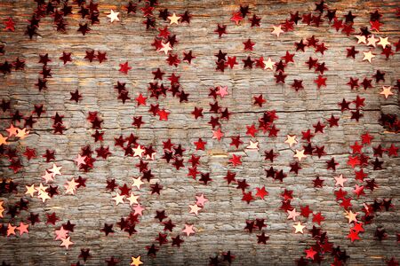 Little shining stars on old wooden backgroundの写真素材