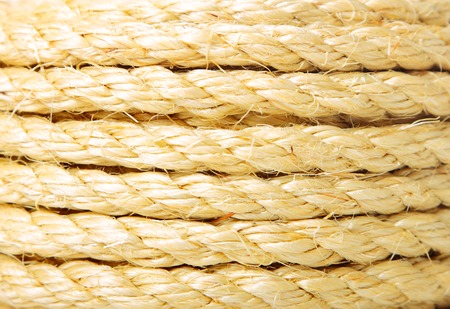 Roll of hemp rope close up background