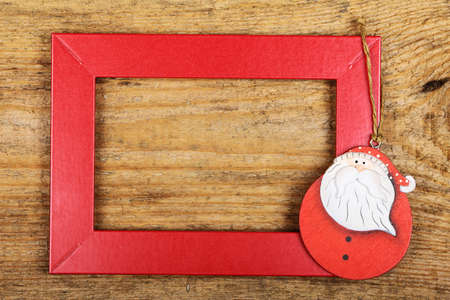 Red frame with Santa on old wooden backgroundの写真素材