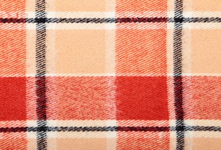 Checkered wool scarf close-up as textured background