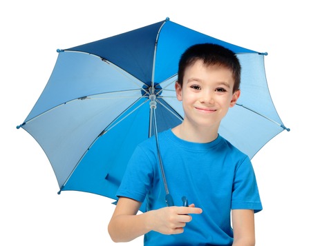 Happy boy holding blue umbrella, isolated on white backgroundの写真素材