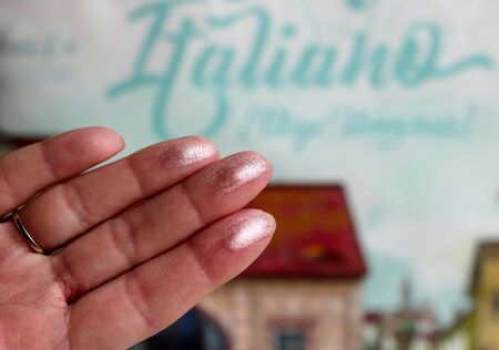 Swatches of shimmer palette eyeshadows on a woman's fingers. Colorful background backgroundの写真素材