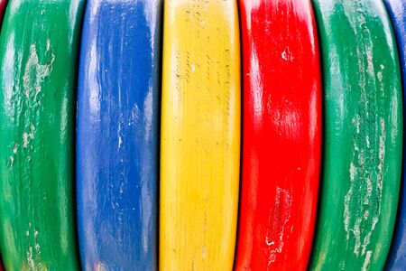 Background of multi-colored wooden boards. Color fence. Wooden texture.の写真素材