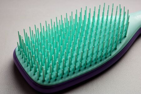 Plastic hair brush close uo view isolated on white.