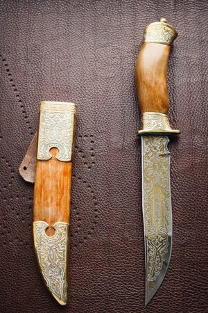 Hunting steel knife with engraving on blade.の写真素材