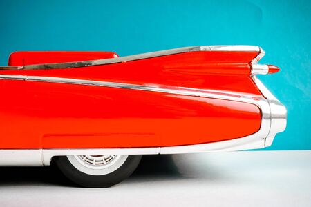 Close up part of red retro vintage car. Colorful cocept background with the part of car.の写真素材