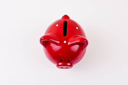 Close up of piggy bank on white background view from above.の写真素材