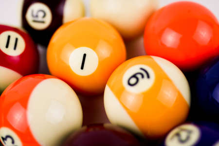 Brightly colored pool or billiard balls close up on white background. Soft focusの写真素材