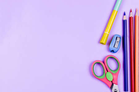 School supplies on a colored background. Childrens still life on the topic of school, study, office work. Flat lay. High quality photoの写真素材