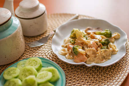 Roasted chicken mushroom pepper pasta in a white plate. toning. selective focus. High quality photoの写真素材