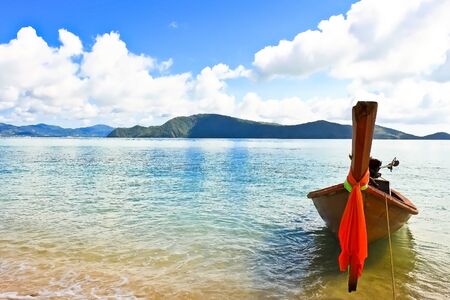 Traditional Thai Long-tail Boat on the Beach, Phuket, Thailandの写真素材