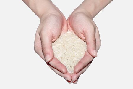Top view of handful of jasmine rice isolatedの写真素材