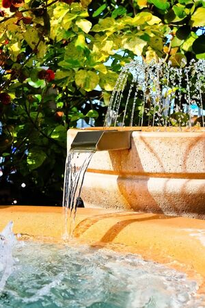 Tropical man made water fountain and waterfallの写真素材