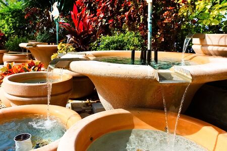 Tropical man made water fountain and waterfallの写真素材