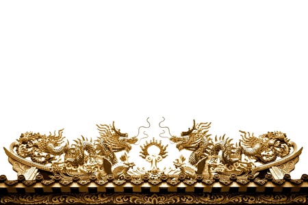 Golden dragon Sculpture on the roof isolated on white backgroundの写真素材