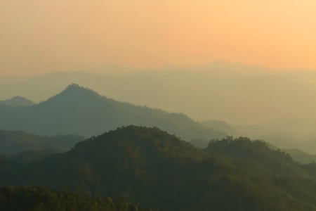 Morning mist and layers of tropical mountain at Huai Nam Dang National Park in Mae Hong Son, Thailand の写真素材