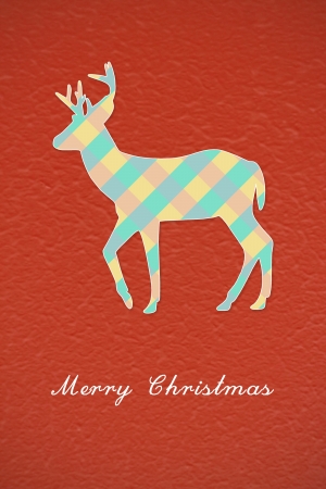 Colorful Christmas reindeer on red backgroundの写真素材