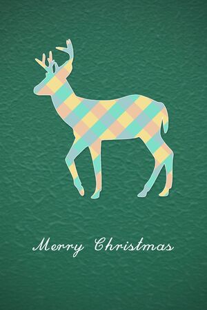 Colorful Christmas reindeer on green backgroundの写真素材