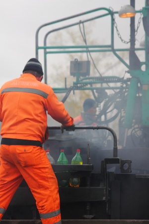 Road workers. The asphalt. の写真素材