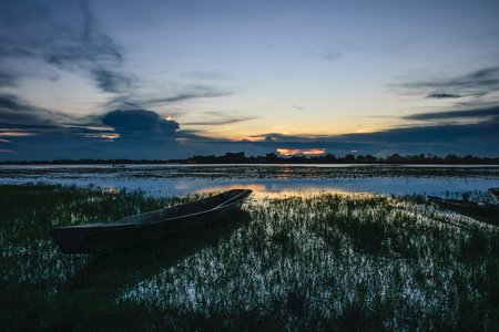 Boats moored in the creek eveningの写真素材