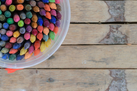 Crayons on the wooden floorの写真素材