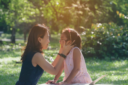 Mother and daughter in the parkの写真素材