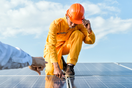 Engineers checking solar panels, Solar Energy ,The concepts of Clean Energy.の写真素材