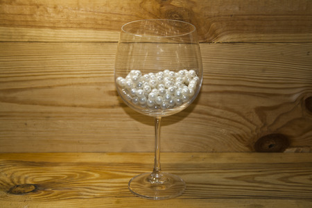 pearls isolated on a wooden backgroundの写真素材