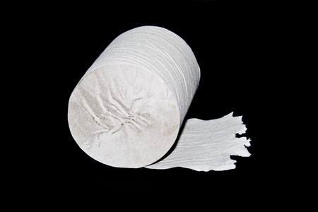 toilet paper isolated on black backgroundの写真素材
